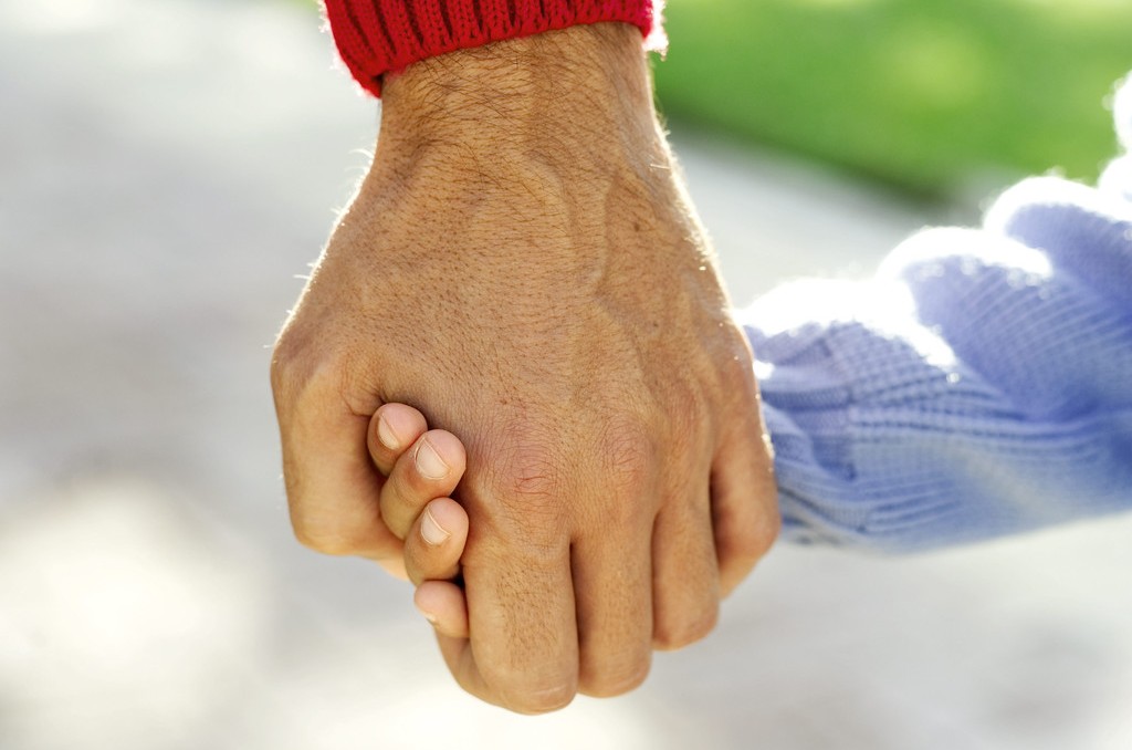 dad and child holding hands