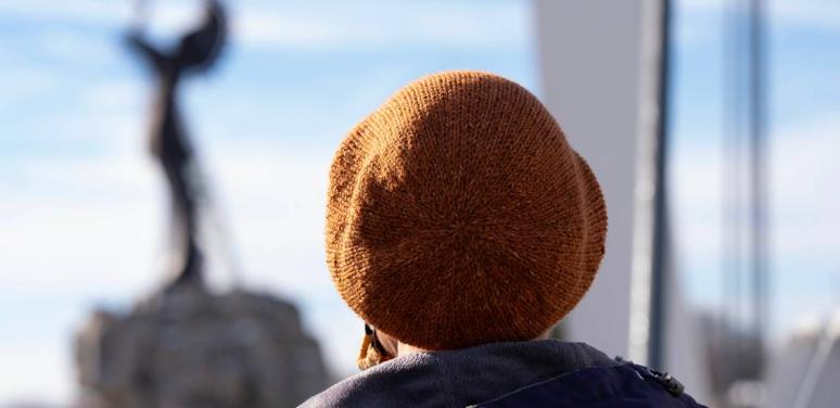 woman looking out window