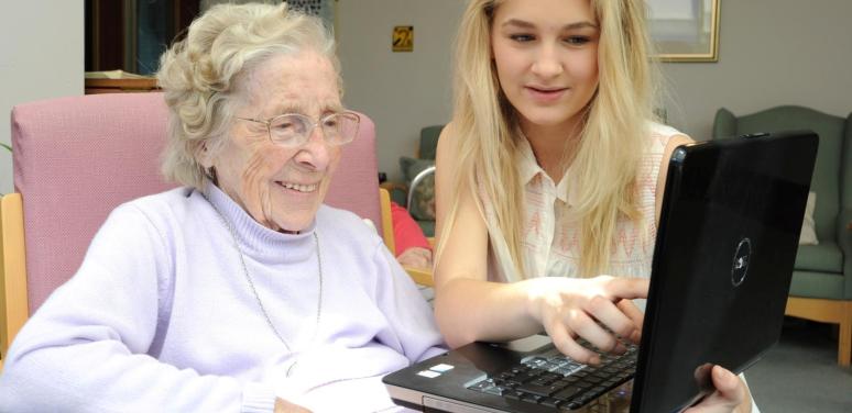 old woman and young woman on computer