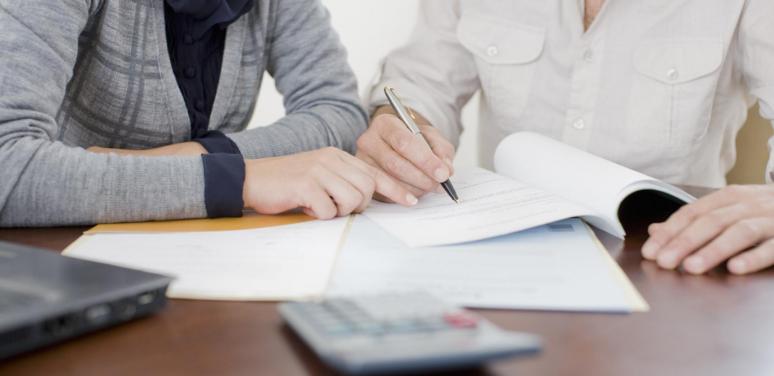 people doing legal paperwork