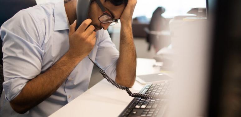 person in distress on the phone