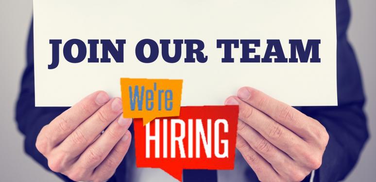 hands holding join our team sign
