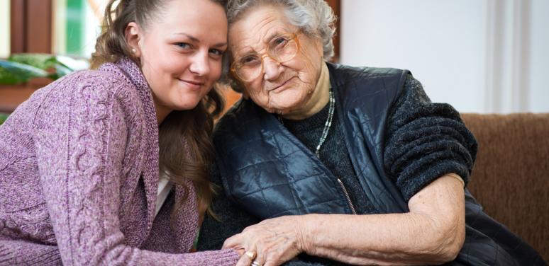 mother and daughter looking at camera