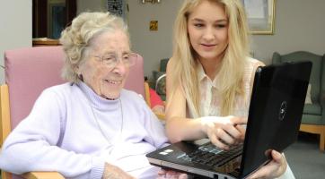 old woman and young woman on computer